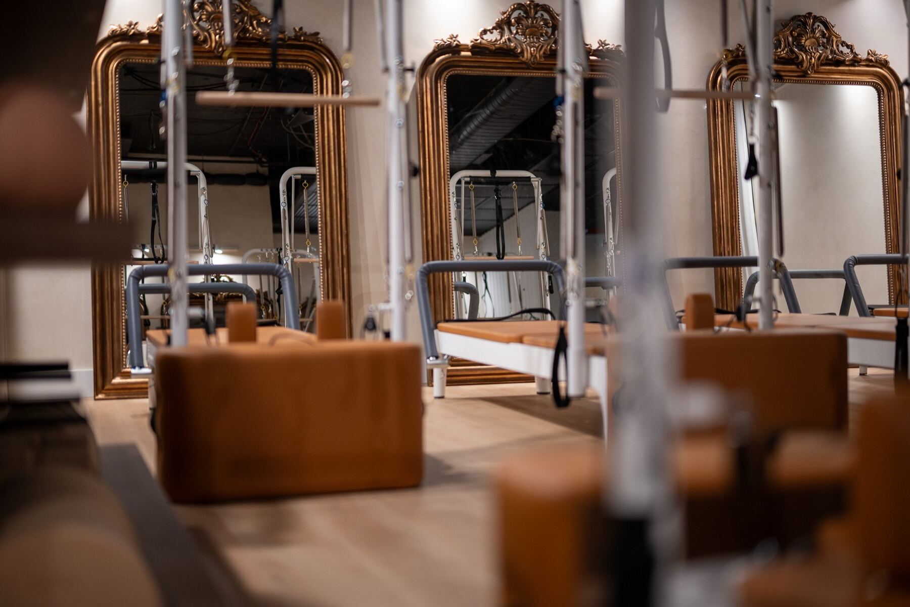 Reformers and towers inside the Aria Pilates studio